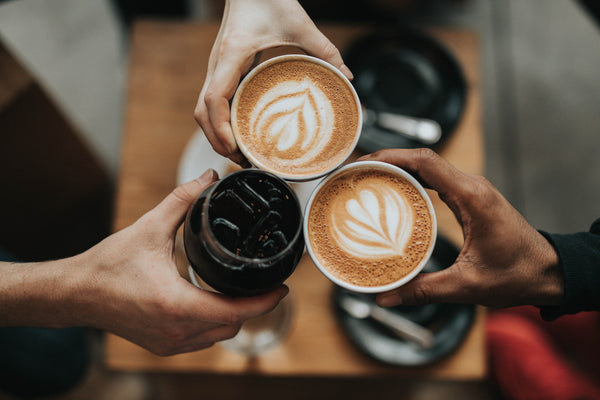 Three person holding cup of coffee