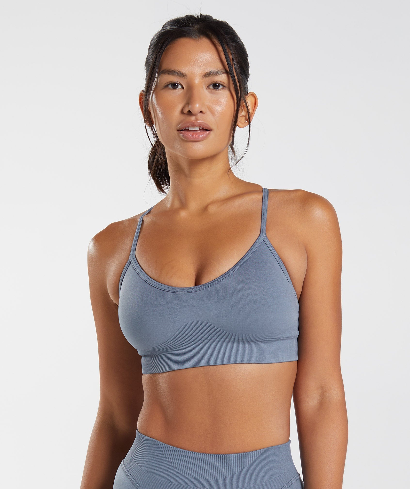 A Woman Is In A Sports Bra And Very Sweaty. Stock Photo, Picture