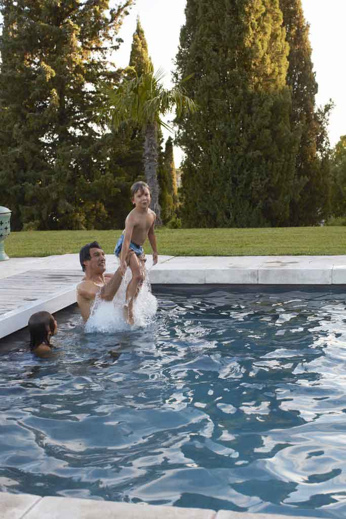 Playing in the pool with Frederic Fekkai and his kids Phillip and Cecilia