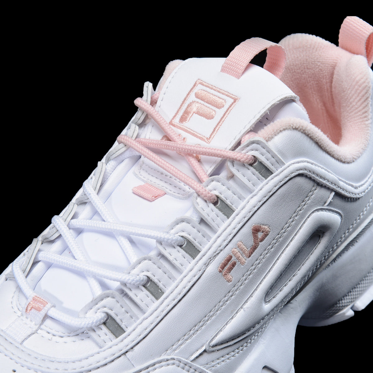 white and pink fila sneakers