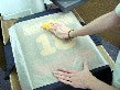 Photo of rubbing design with pad or chalkbaord eraser