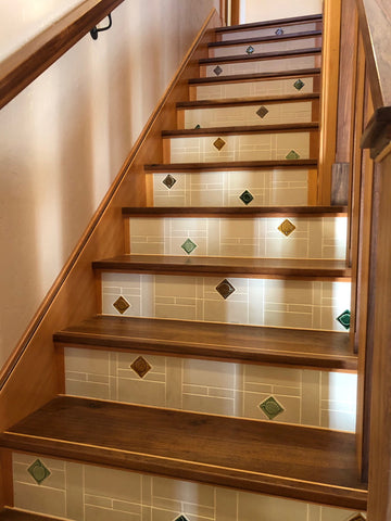 handcrafted staircase with tiled risers featuring handmade tiles