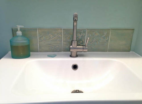 Handmade tile as a bathroom sink back splash 