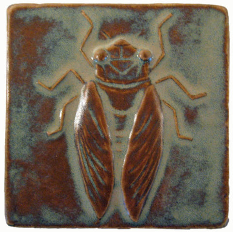 handmade tile with a cicada design in a four inch size