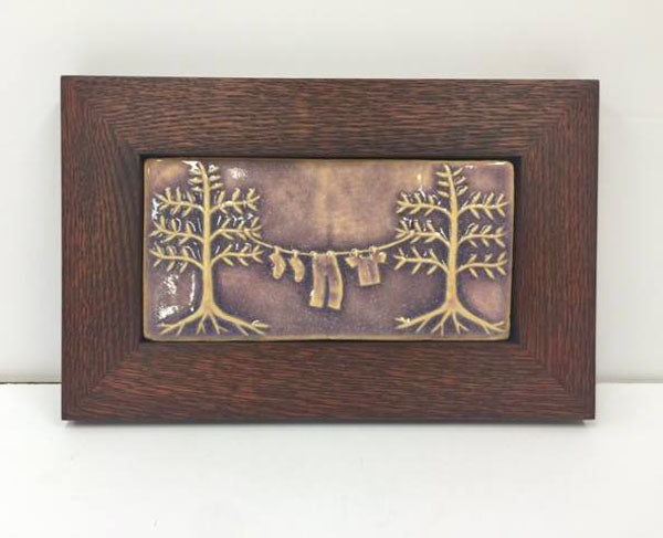 handmade tile framed in an oak park frame