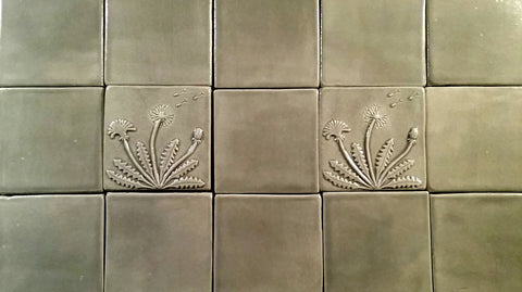 gray handmade tiles featuring a dandelion, four inch size