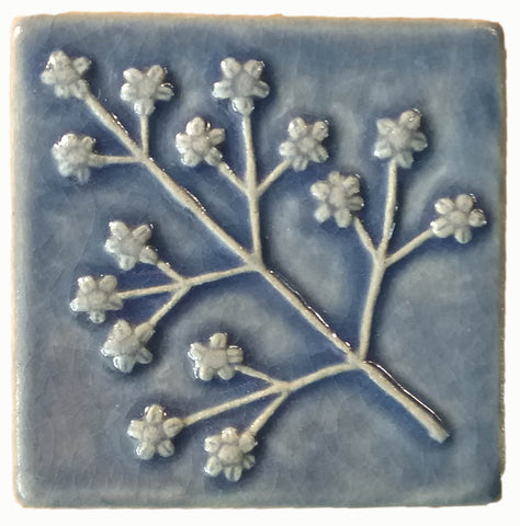 delicate floret four inch by four inch handmade tile blue glaze