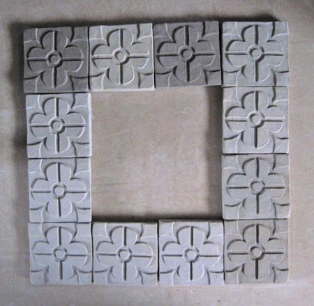 some unglazed unfired bisqued ceramic arts and crafts tiles