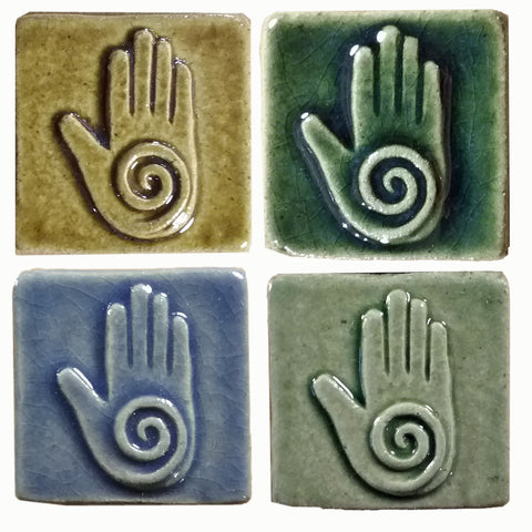 healing hand handmade tiles in four different glazes, two inch by two inch size