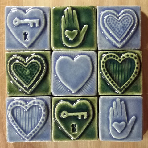 handmade heart tiles in a grid, blue and green glaze, two inch size