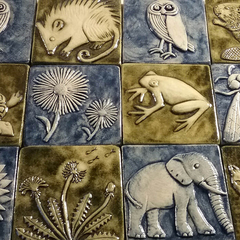 four inch size handmade tiles featuring plants and animals, blue and green glazes