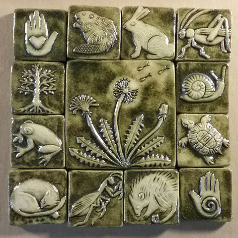 dandelion handmade tile with a two inch border, copper green glaze
