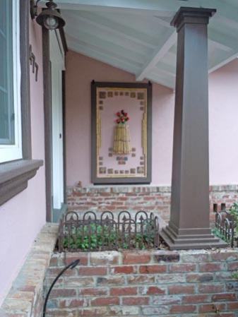 arts and crafts home with handmde art tile entryway