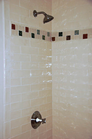 handmade tile border in a bathroom shower