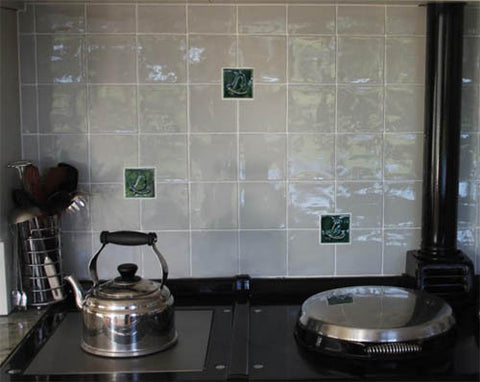 handmade mayfly tiles over a range in a kitchen