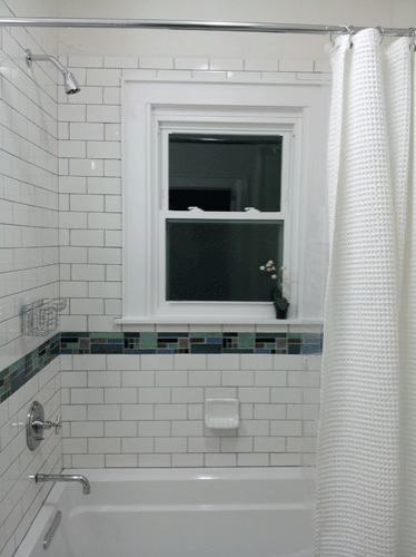 blue and green glass mosaic and white subway tiles with art tile features