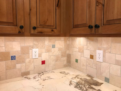 multicolored handmade tiles in a kitchen backsplash