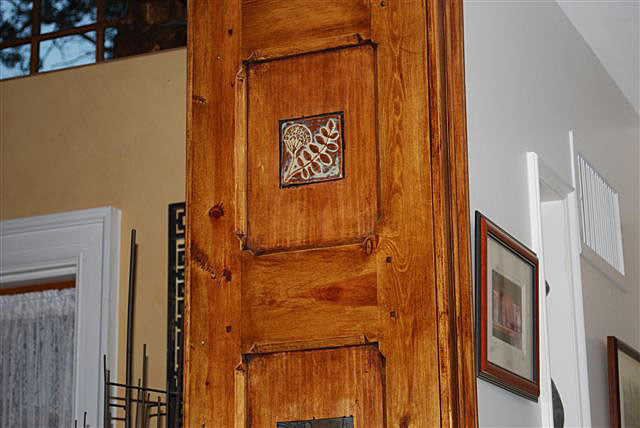 wooden door frame with handmade art tiles, wildflower design