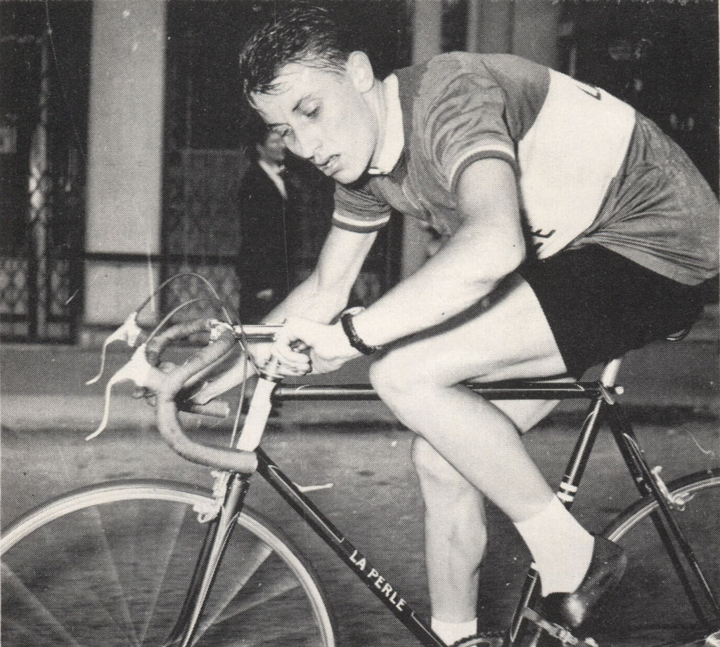 A young Jacques Anquetil checks his watch during the 1953 Grand Prix des Nations