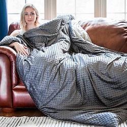 woman with weighted blanket