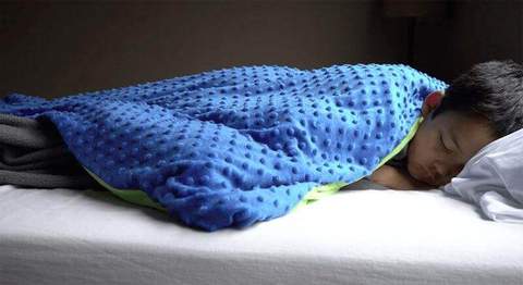 child sleeping with blanket