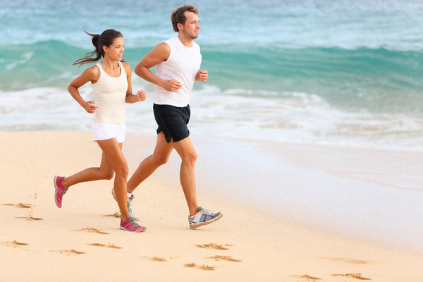 couple wearing light colored clothing while exercising in summer
