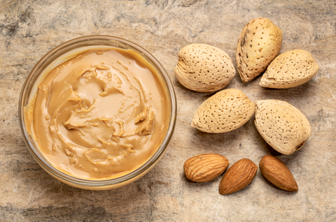 almond butter on wooden counter top