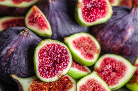 Slices of juicy red figs, background