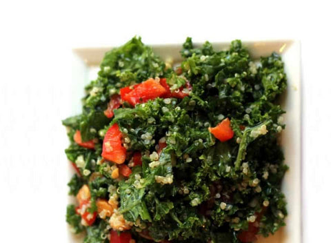kale and quinoa salad on white plate