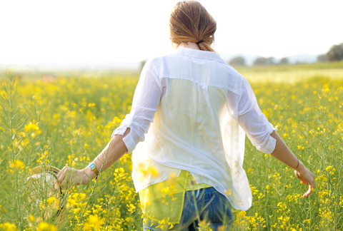 woman in white shirt in field