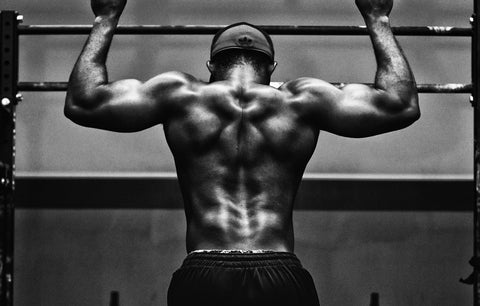 Man doing pull ups on a bar