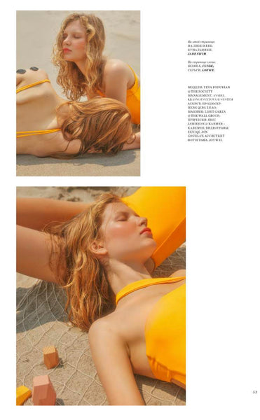 Women Laying On The Beach Wearing An Orange Jade Swim Swimsuit 