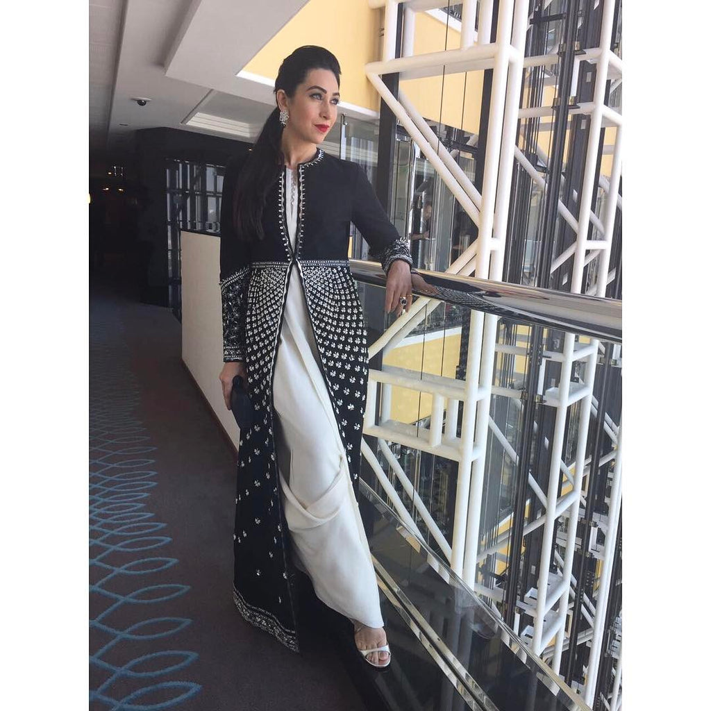  Karishma Kapoor in an elegant white and black Suit with long black maxi jacket from AM:PM