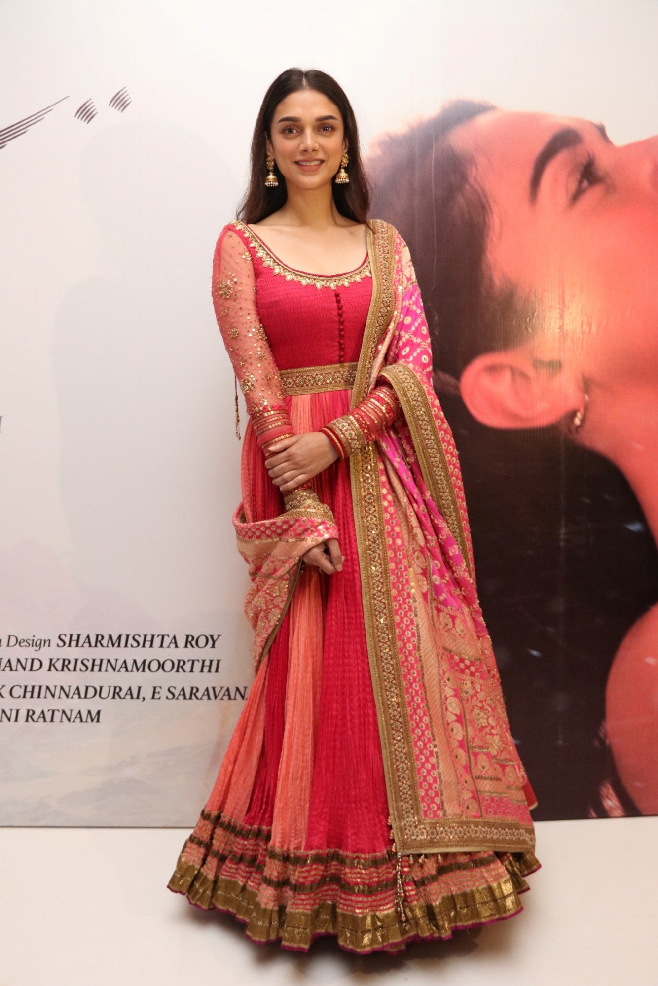Aditi Rao Hydari in red & pink color Floor Length Crushed Anarkali Suit Indian Ethnic Wear at her upcoming movie Kaatru Veliyidai audio Launch event  