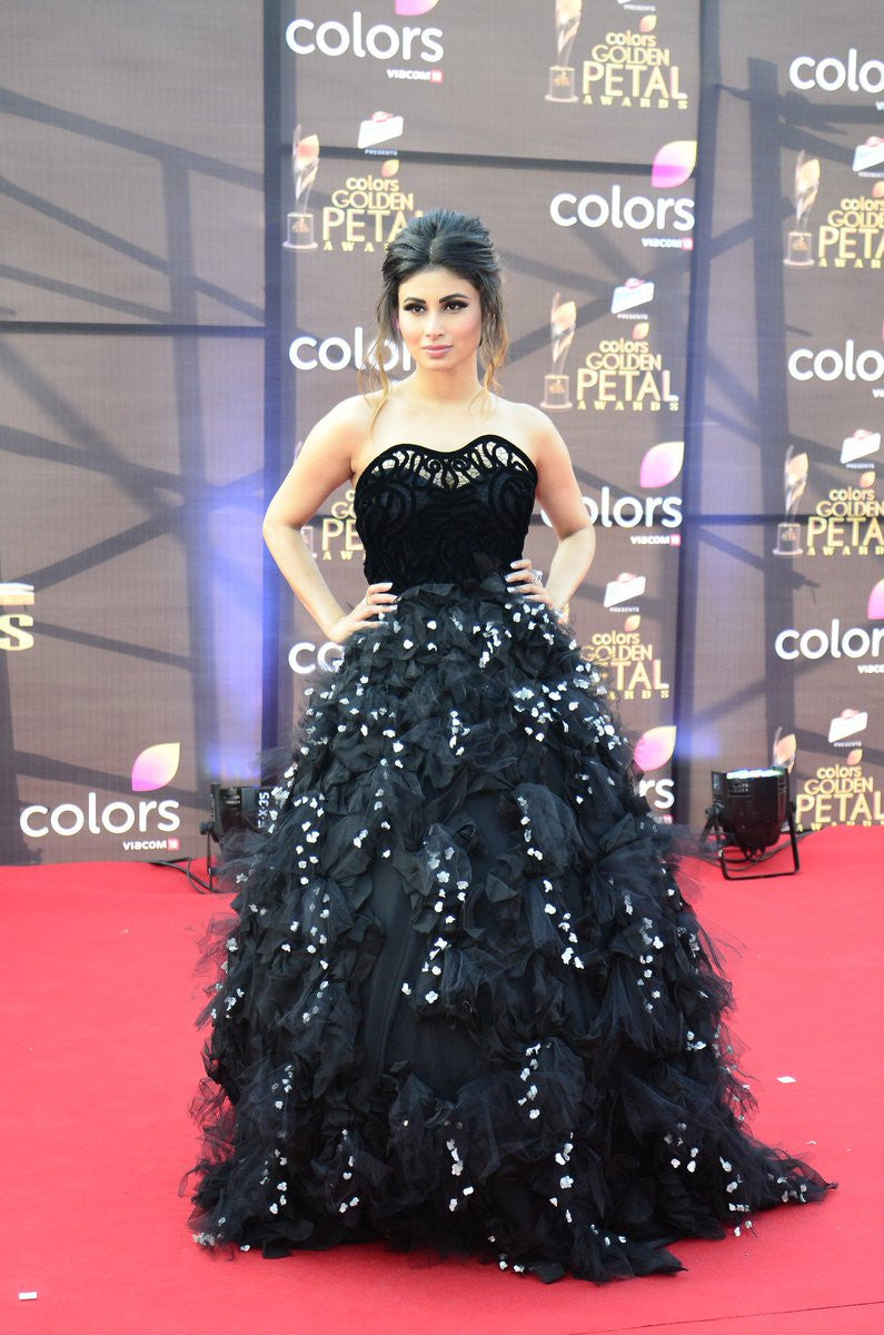 Mouni Roy wore a black strapless gown with a tulle and floral applique ball gown skirt by Karleo at Golden Petals Award