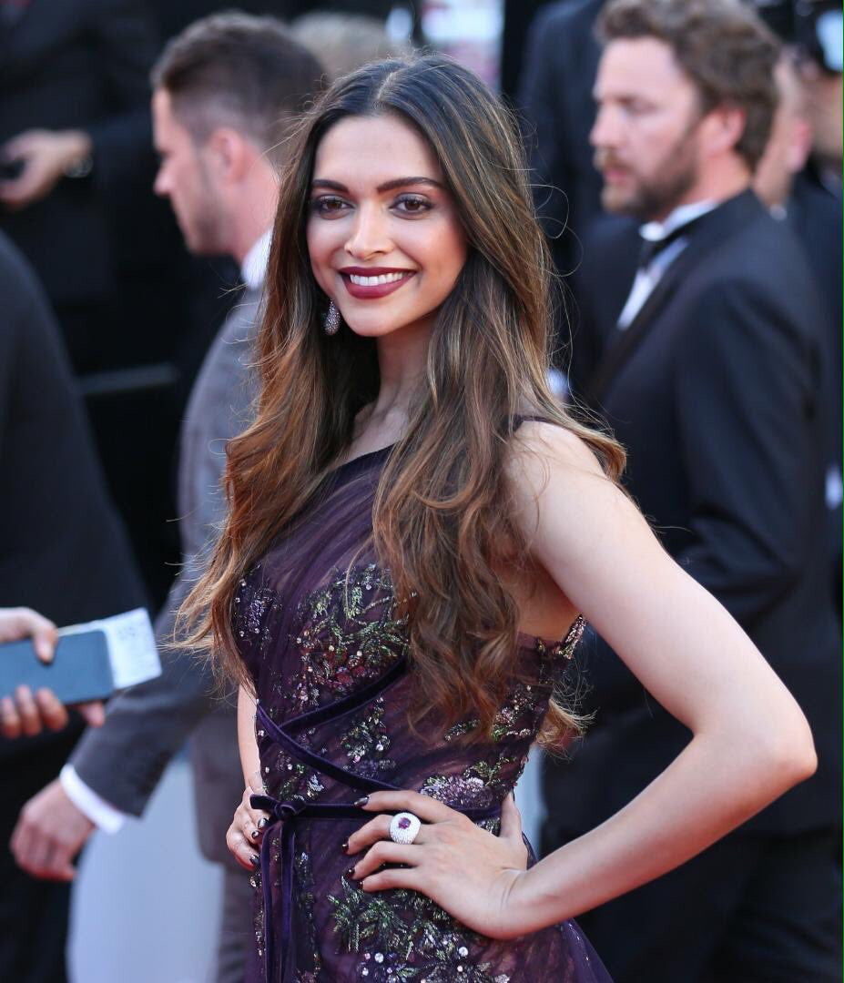 Deepika Padukone walked the red carpet for the Cannes Film Festival wore a sheer purple Marchesa outfit, and paired it with De Grisogono jewelry and Jimmy Choo heels
