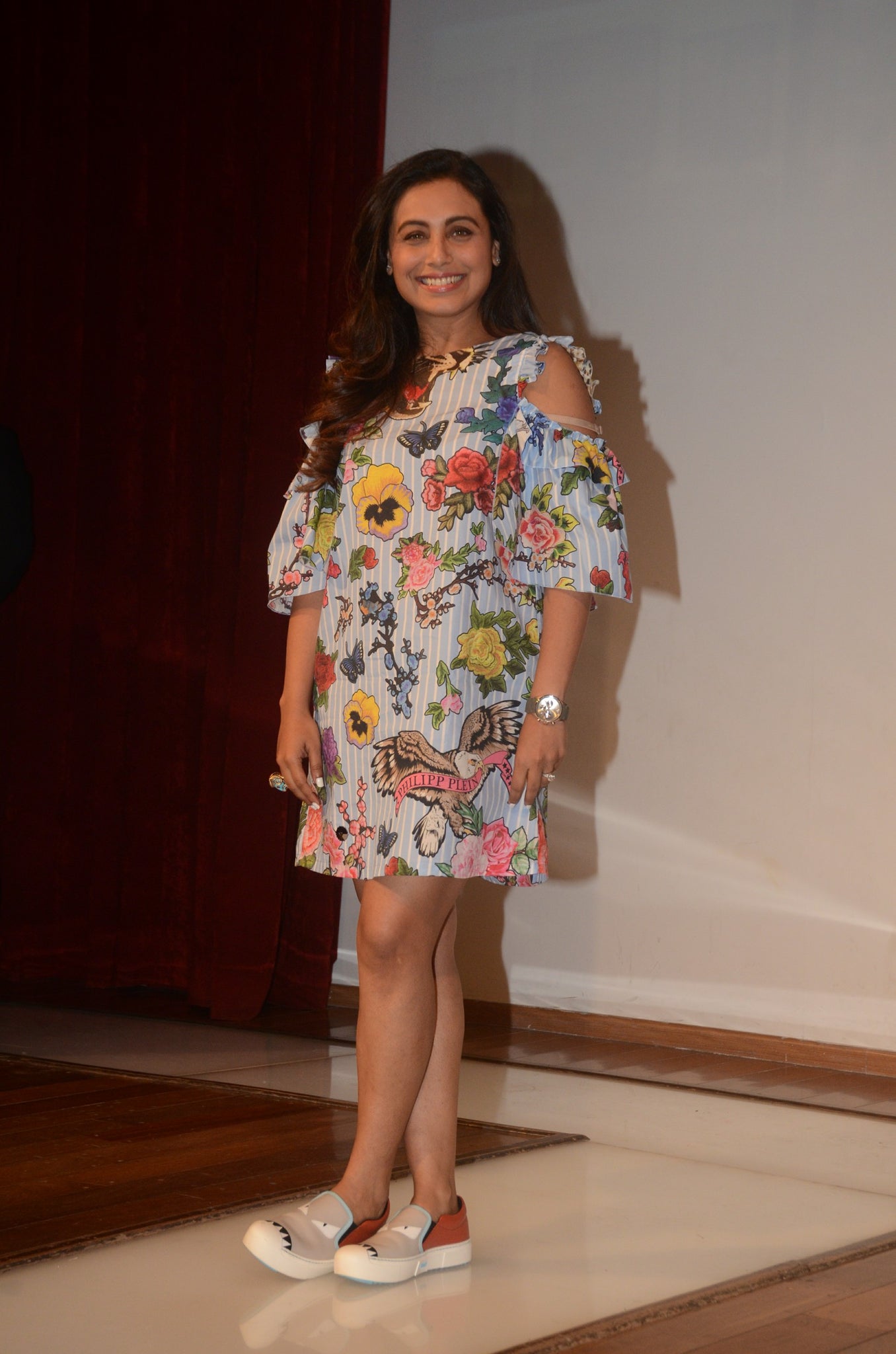 Rani looked pretty in a floral printed cold shoulder midi dress with quirky shows. Quirky loafers simple curls added elegance to the fun look.
