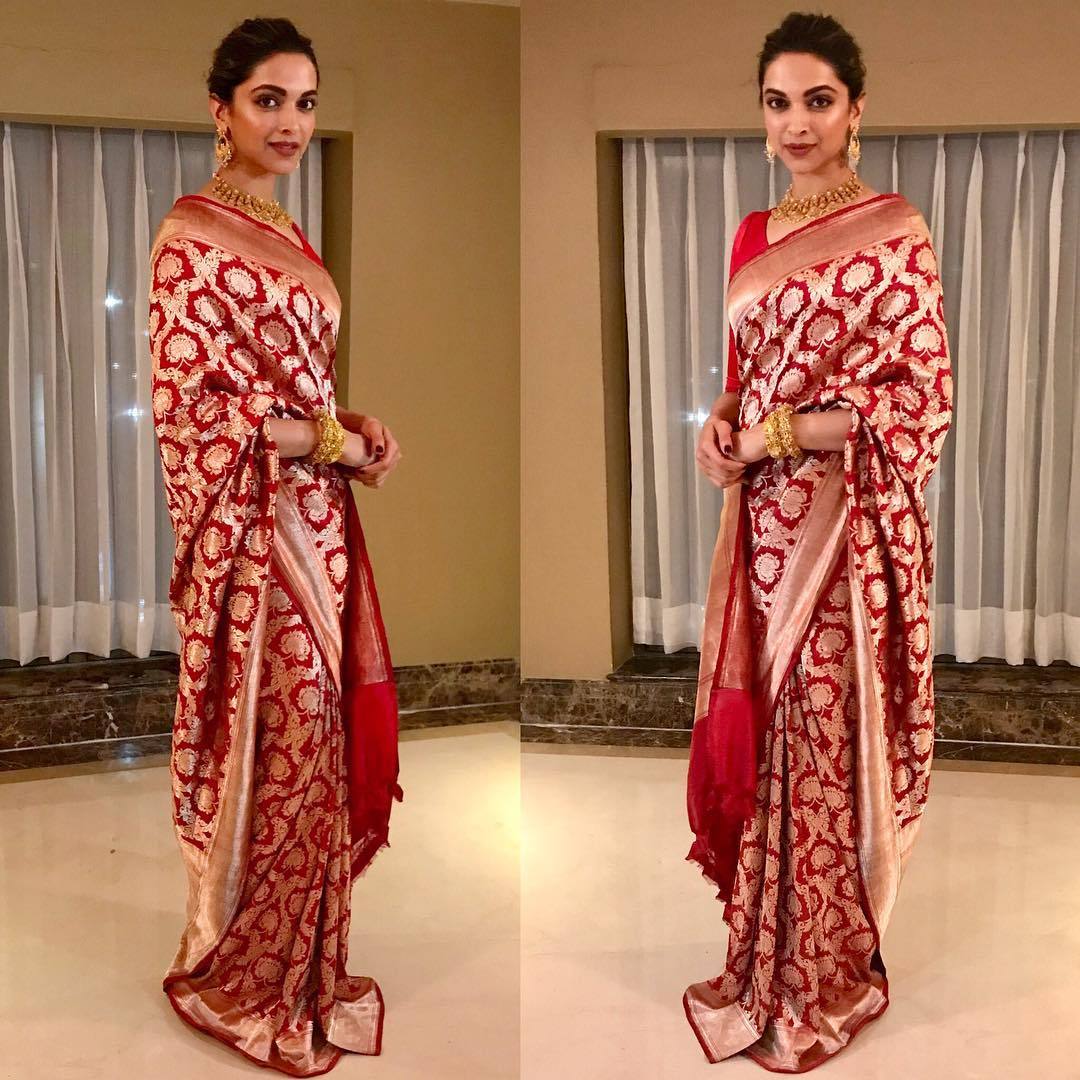 Deepika Padukone looked like a bridal in beautiful red and gold banarasi silk saree from Sanjay Garg’s label, Raw Mango.