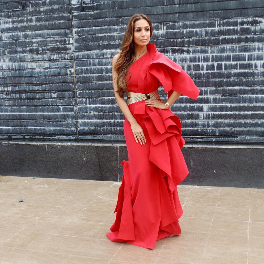 For the shoot of India's next Super model Malaika Arora wore a dramatic ruffled gown by Gaurav Gupta in a firey red hue