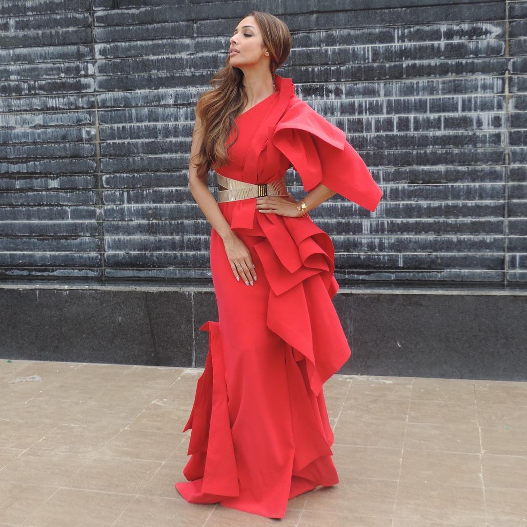 For the shoot of India's next Super model Malaika Arora wore a dramatic ruffled gown by Gaurav Gupta in a firey red hue
