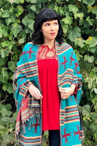 ShopMucho owner styles ways to wear the southwest style shawl with the Mexican blouse and skinny jeans