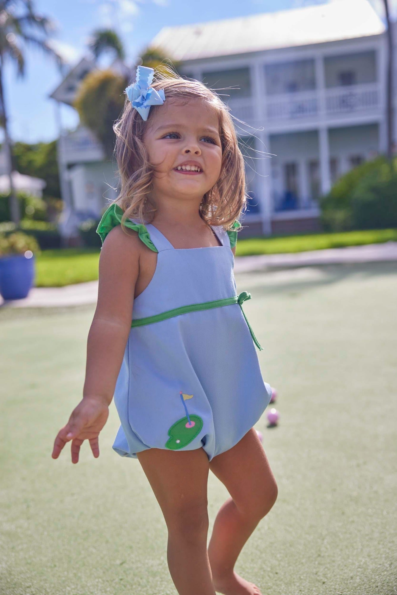 classic childrens clothing girls blue bubble with green ruffle sleeves and applique golf