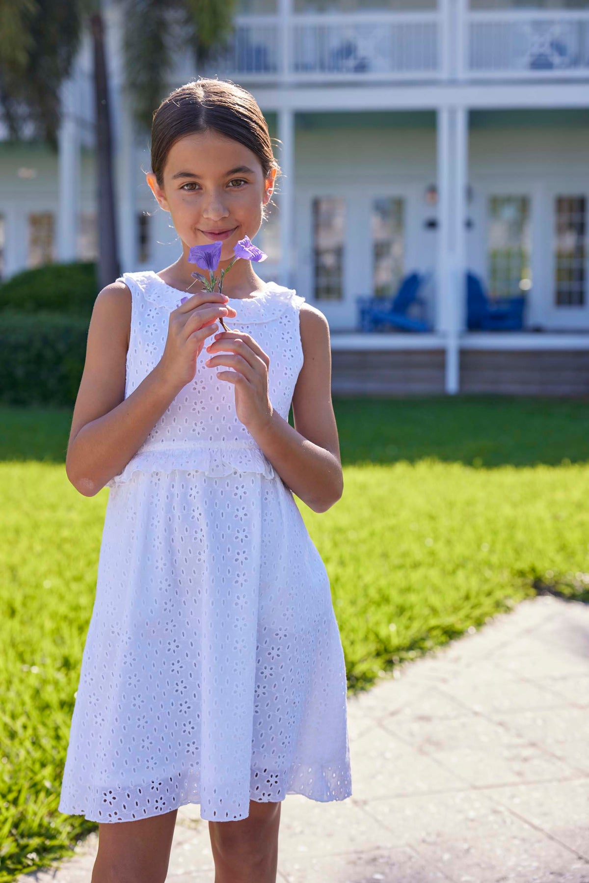 classic childrens clothing girls white eyelet dress with ruffle trim around waist and neckline