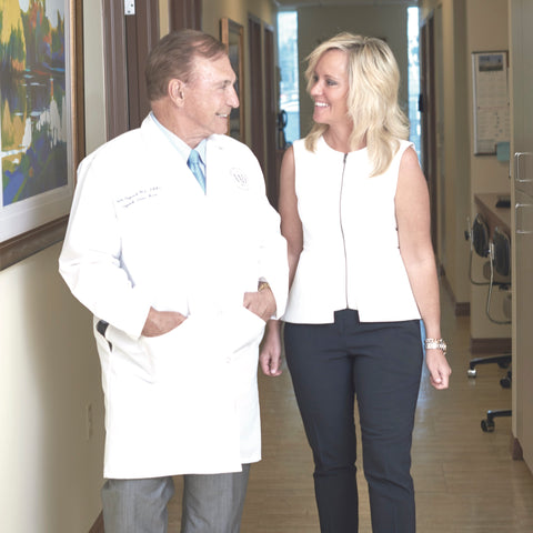 Dr. M.M. Vujevich shown during a conversation with Christine Vujevich in their office