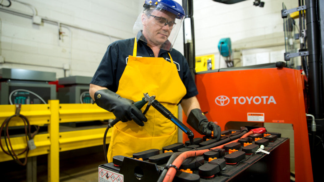 technician fixing a battery