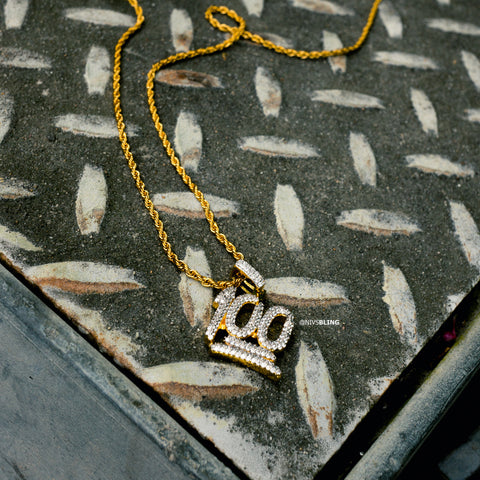 18k Gold Iced Out Cubic Zirconia Emoji 100 Hip Hop Pendant featured on a diamond cut metal