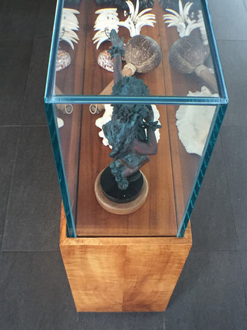 Glass and koa hardwood display case in the Grand Naniloa Hotel Hilo lobby.