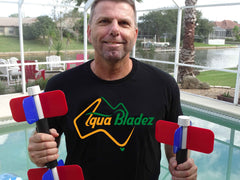 Aqua Bladez USA owner Graham Allen holding Aqua Bladez in front of pool