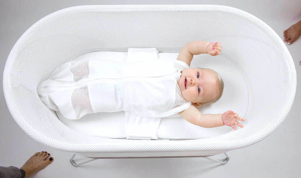 baby rolling over in bassinet