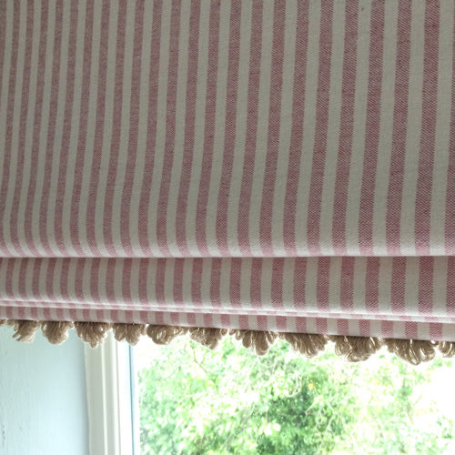 roman blind in pink and white stripe with pretty trim